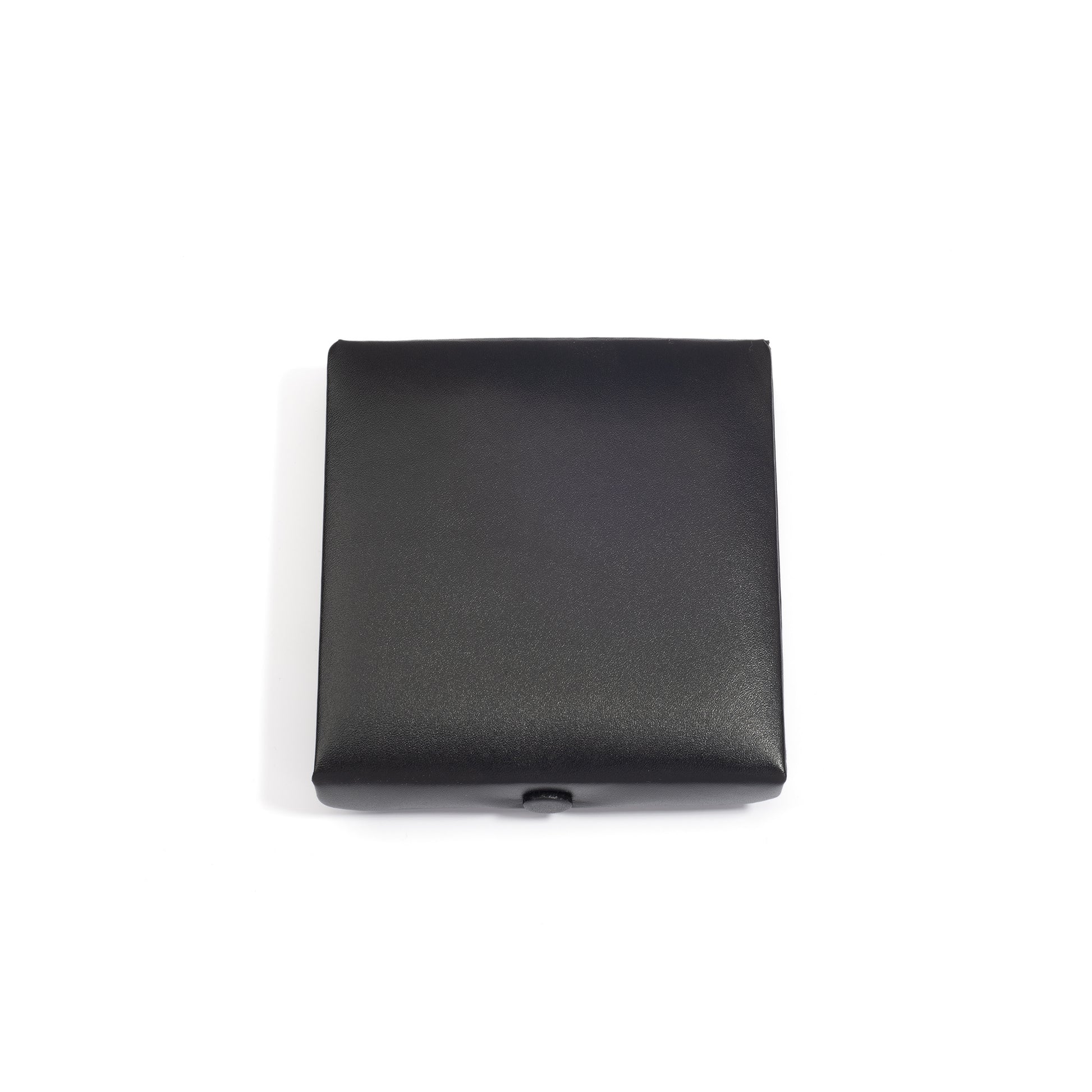 A closed black medium square jewelry box with a smooth surface, viewed from above