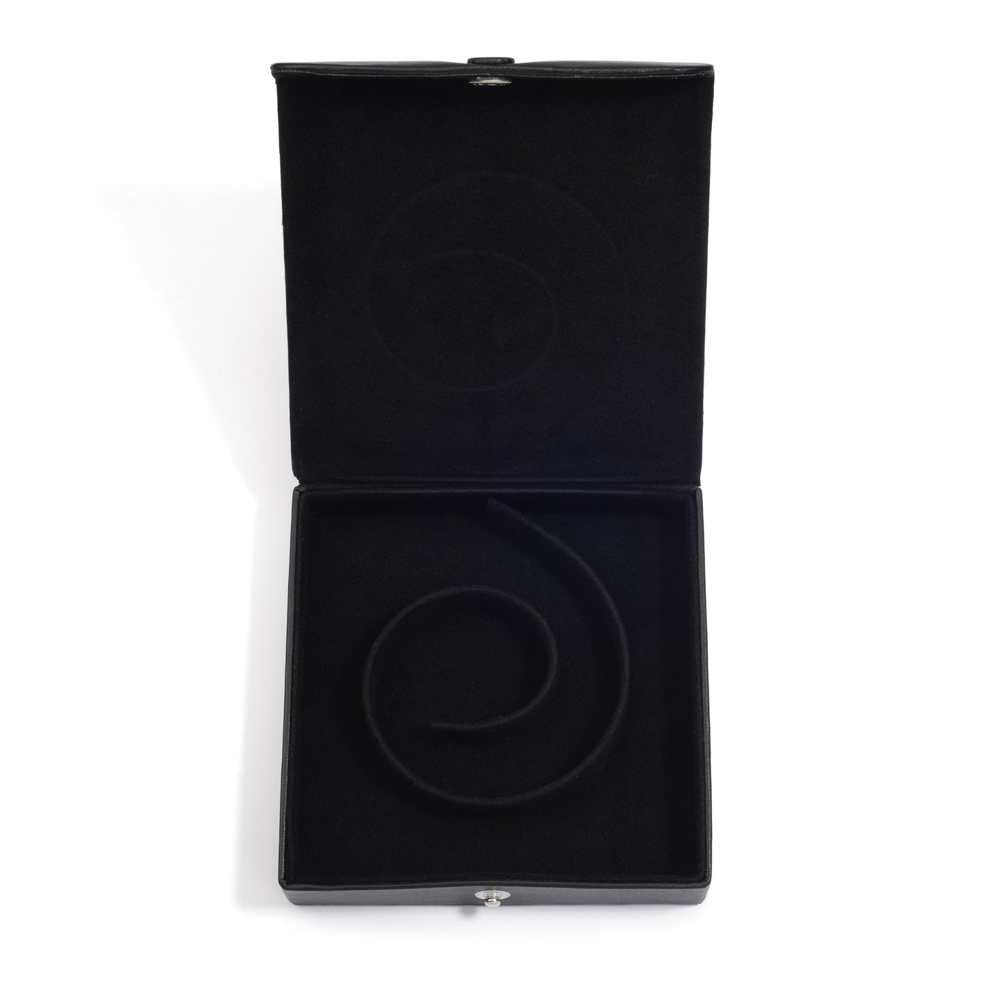 An open black medium jewelry box with a spiral groove inside, designed to hold a pearl coil necklace