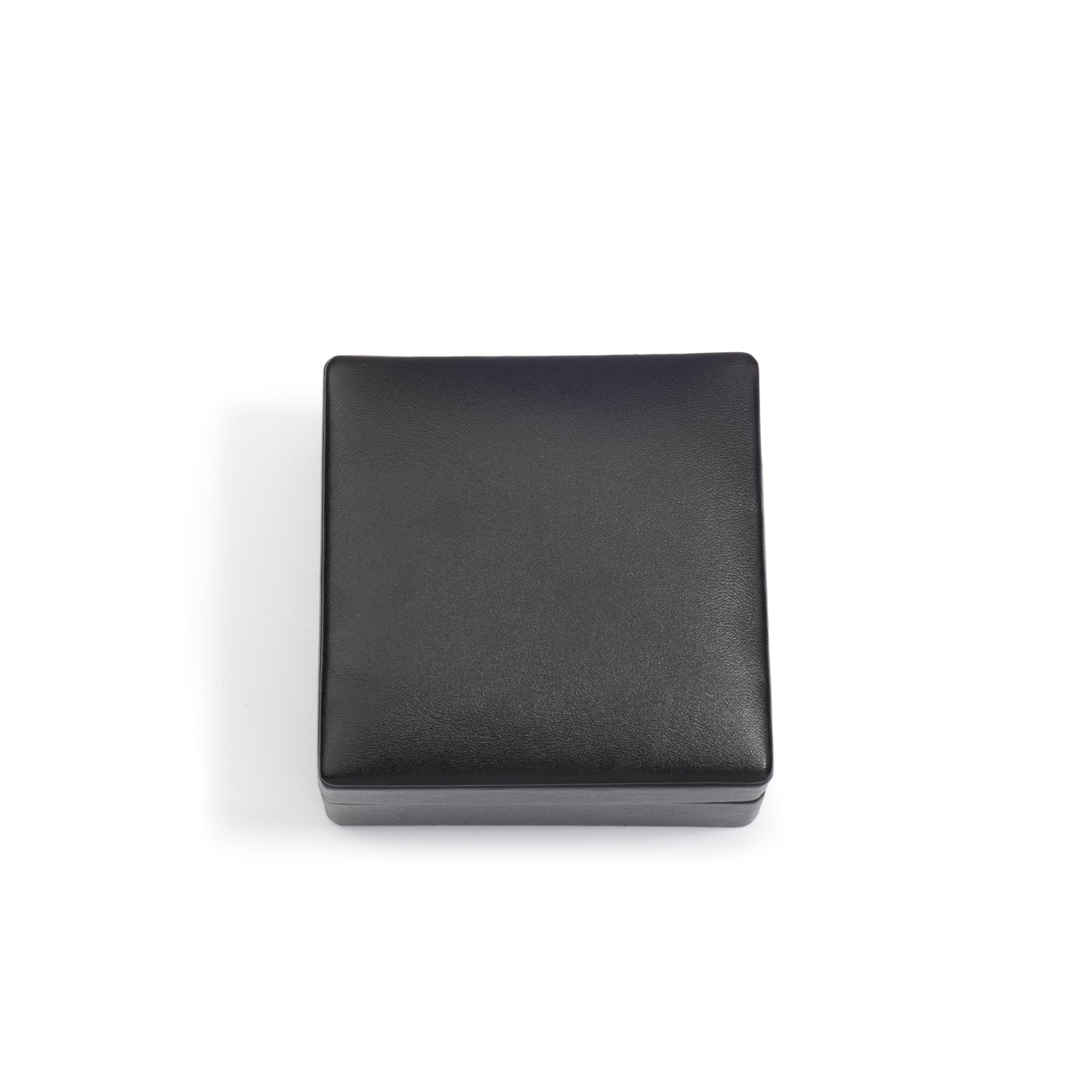 A closed, square-shaped black jewellery box with a smooth finish, positioned against a white background.